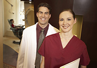 doctor and assistant smiling